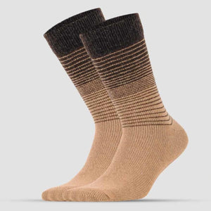 A pair of beige Alpaca merino wool socks with a brown stripe