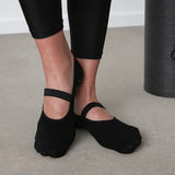 image of feet in black yoga socks