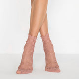 person wearing baggy nude coloured quarter length socks lace inspired