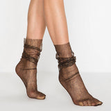 Woman wearing black and rose gols loose fitting tule glamour socks