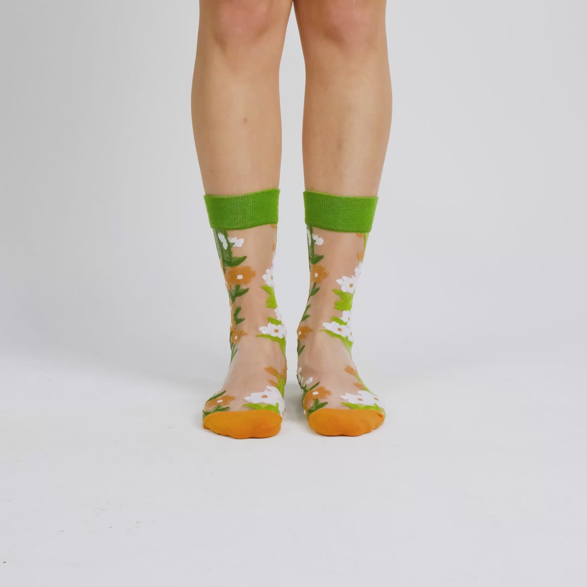 video of sheer socks with plant detail